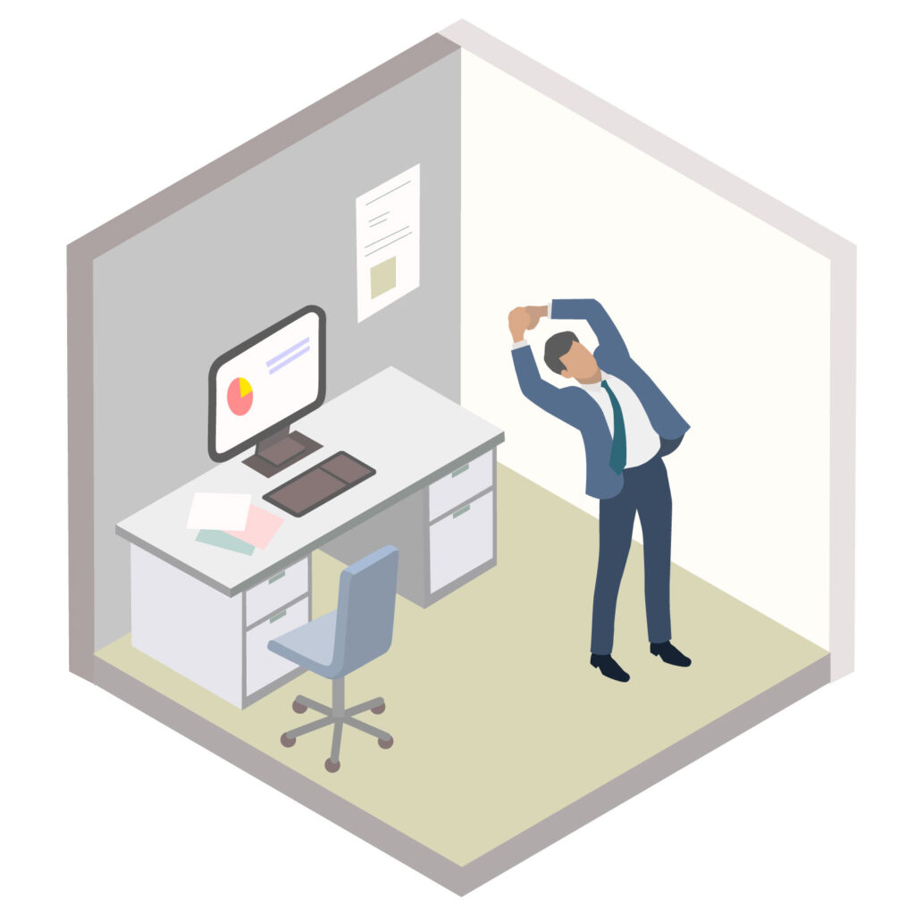 オフィスでパソコンのあるデスクから立ち上がり、体を横にそらしストレッチをして疲れをとっているサラリーマンを示している。